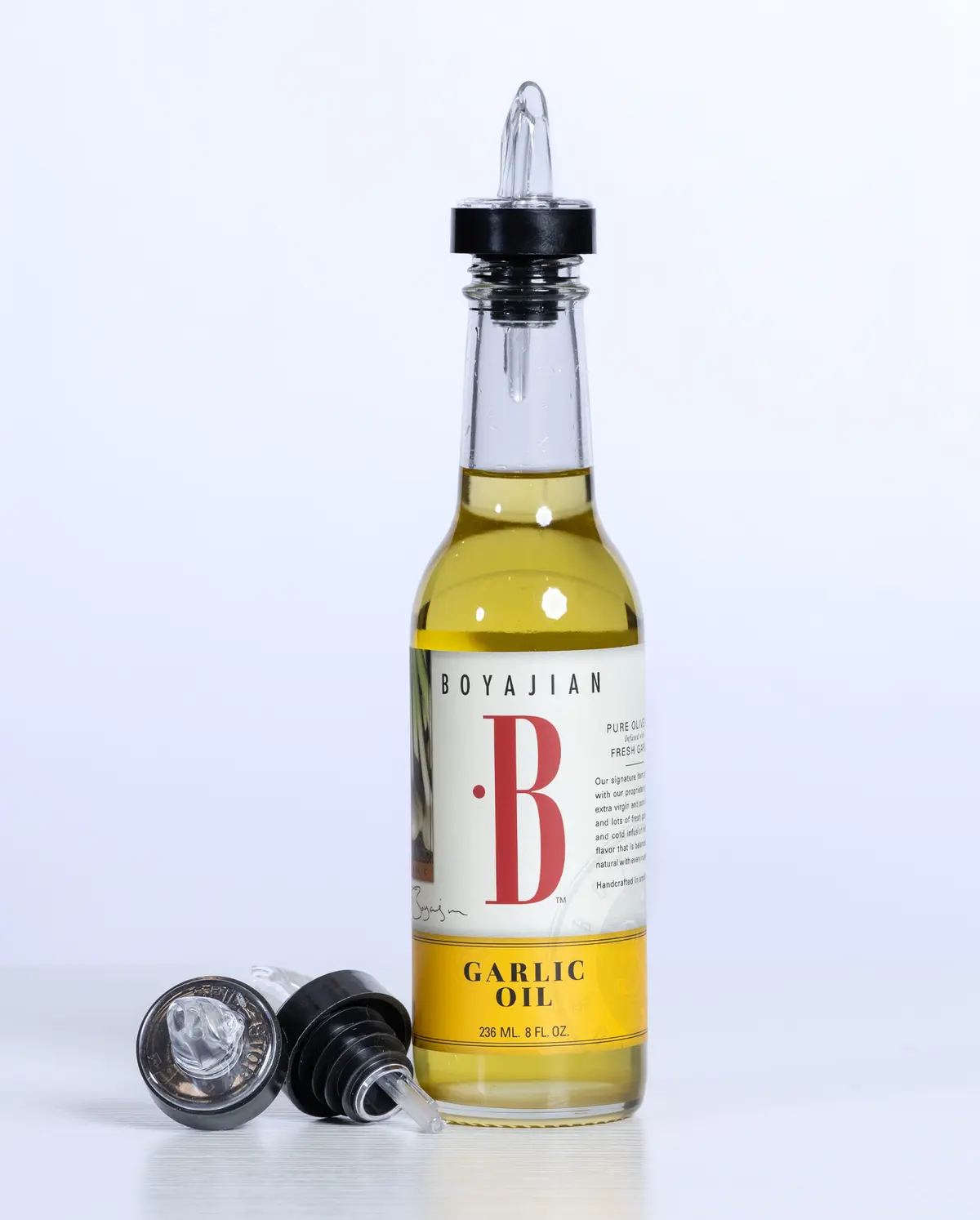 Bottle of garlic oil with pourer