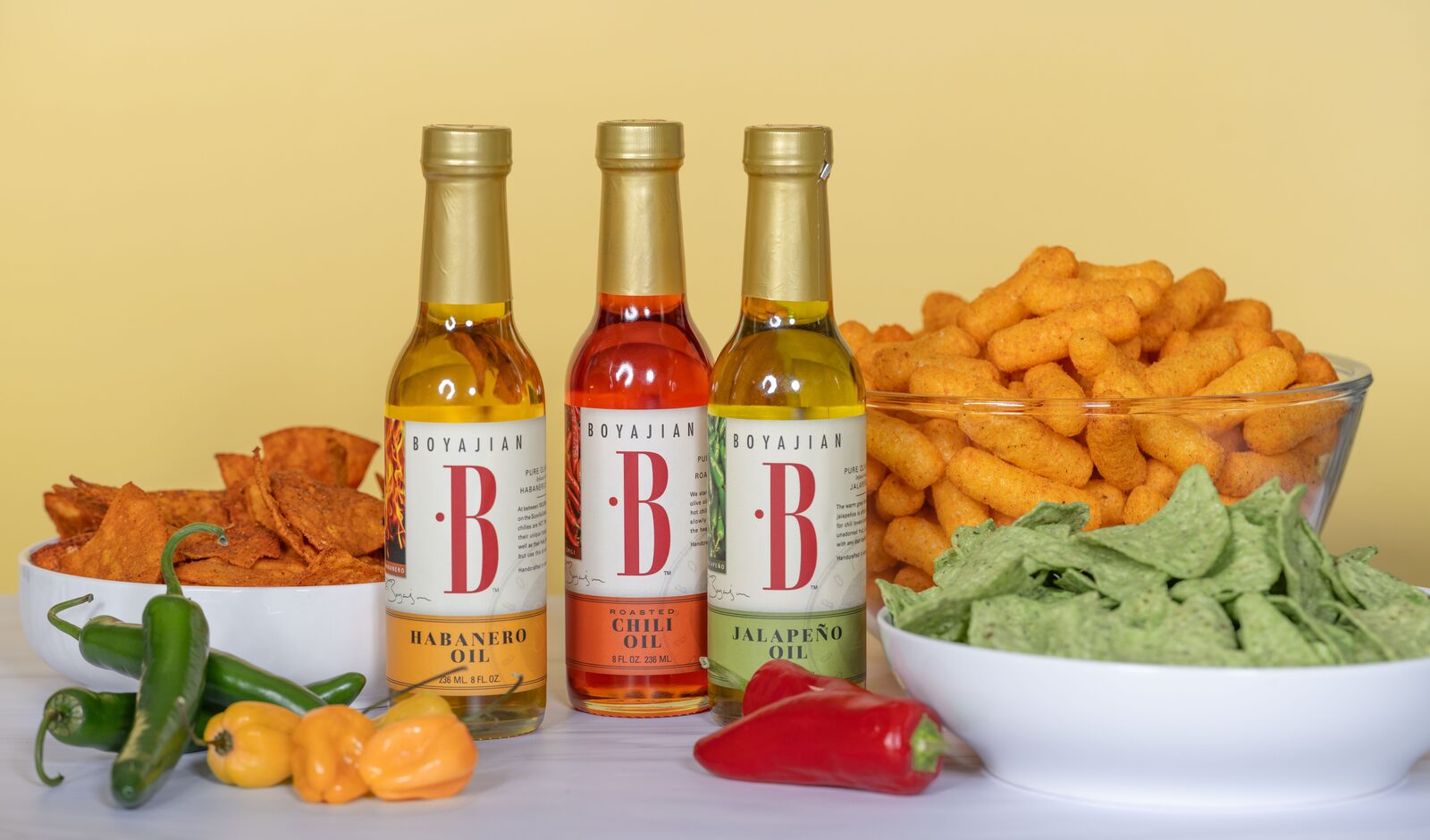 Chili oils and flavored coating systems for snacks